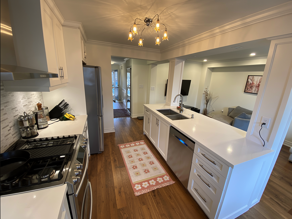 Kitchen renovation finishing details - cabinetry, counters, and trim work